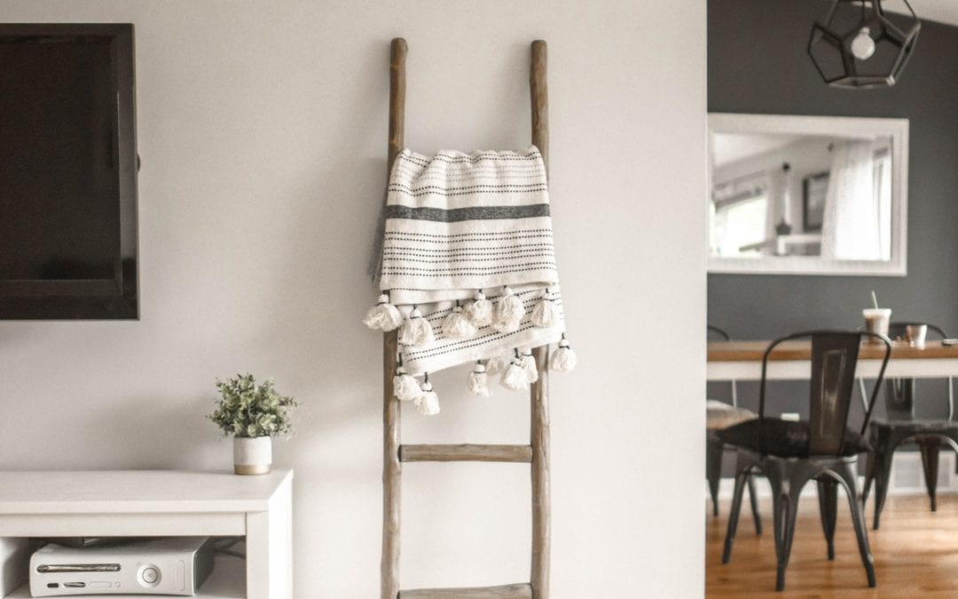 gray-wooden-ladder-on-white-painted-wall. Hard flooring cleaning tips and guide for home. Luxenta Cleaning Blog